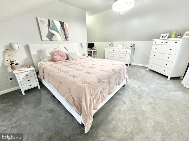 bedroom featuring carpet and vaulted ceiling