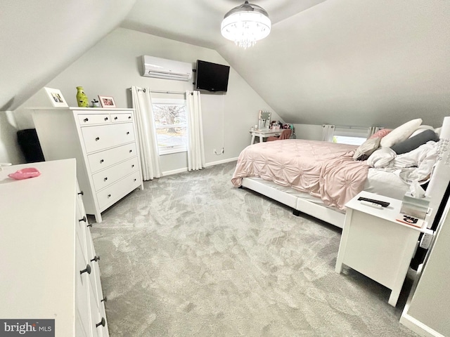 bedroom with light colored carpet, a wall unit AC, and lofted ceiling