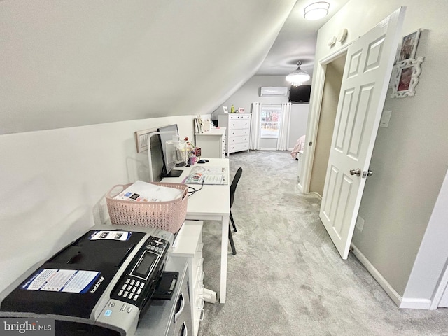 office with a wall mounted air conditioner, light colored carpet, and vaulted ceiling