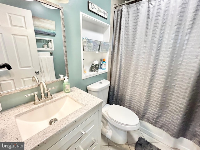 full bathroom with tile patterned flooring, vanity, toilet, and shower / tub combo