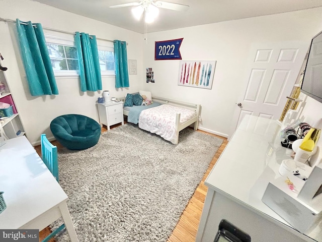 bedroom featuring hardwood / wood-style floors and ceiling fan