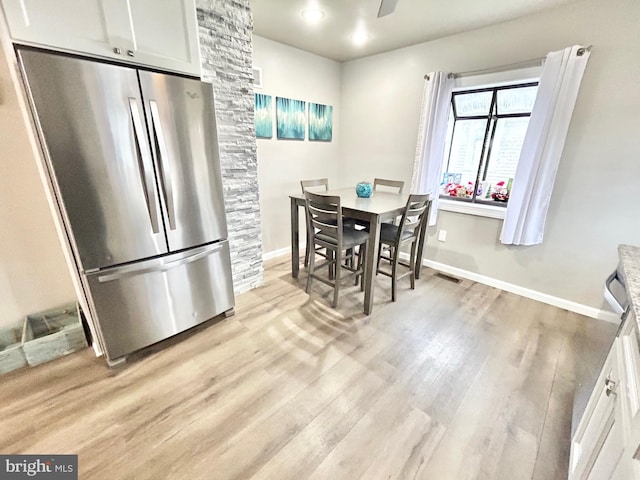 dining space featuring light hardwood / wood-style flooring