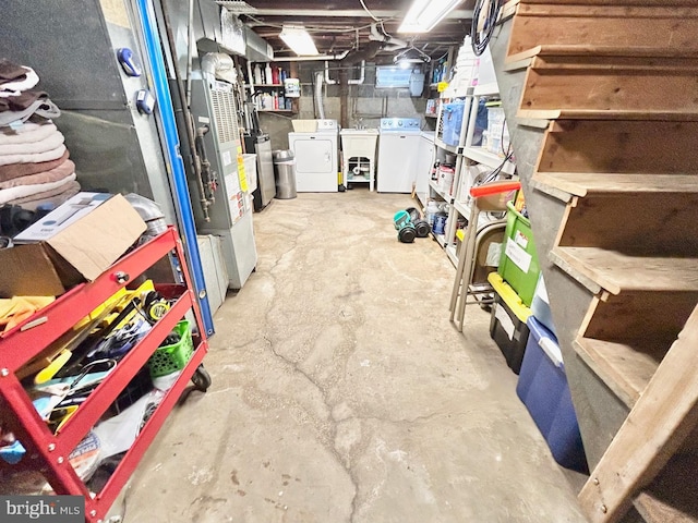 basement featuring washer and dryer and sink