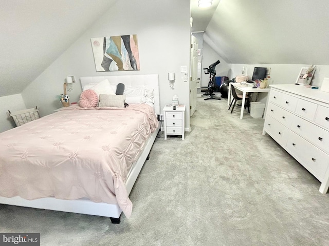 bedroom with lofted ceiling and light carpet