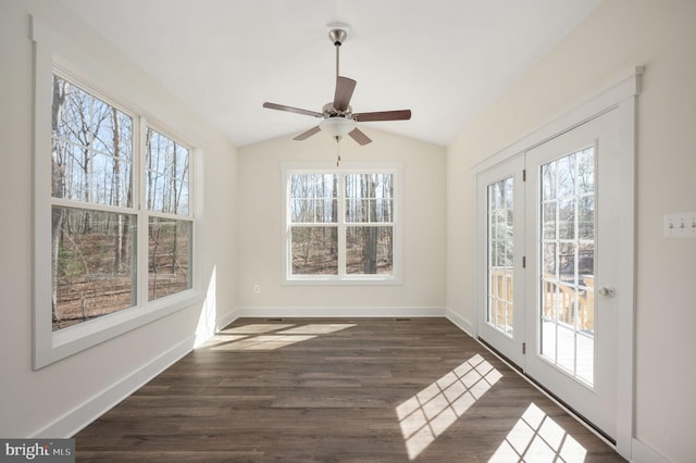 unfurnished sunroom with ceiling fan and vaulted ceiling