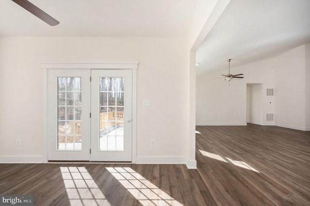 interior space with vaulted ceiling, ceiling fan, and dark hardwood / wood-style flooring