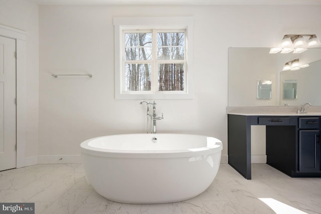 bathroom featuring a tub to relax in and vanity