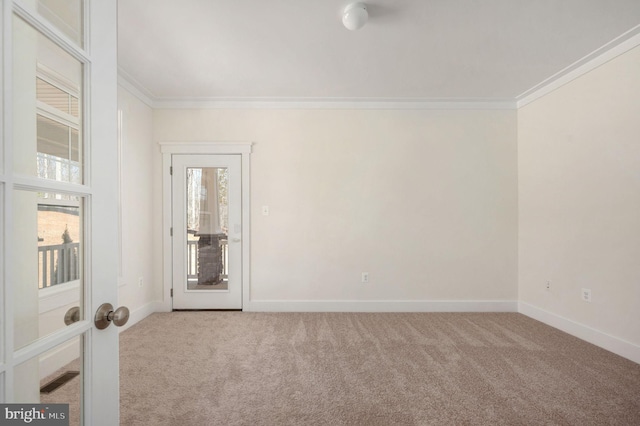 carpeted spare room with crown molding