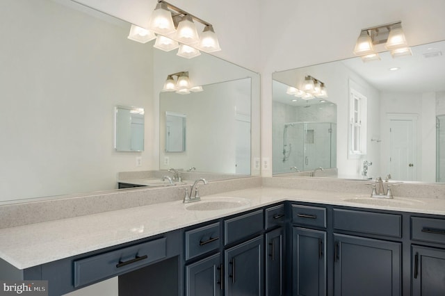 bathroom with walk in shower and vanity