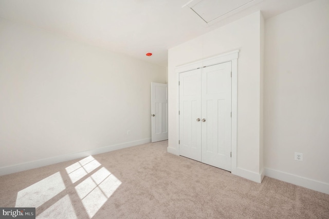 unfurnished bedroom featuring light carpet