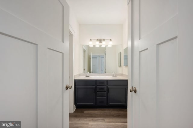 bathroom featuring vanity and hardwood / wood-style floors