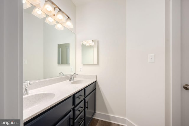 bathroom featuring hardwood / wood-style floors and vanity