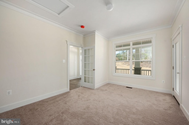 unfurnished room with light colored carpet, french doors, and crown molding