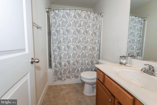 full bathroom with tile patterned floors, vanity, shower / bath combo, and toilet