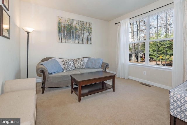 carpeted living room featuring a wealth of natural light