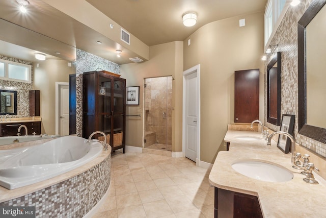 bathroom featuring tile patterned flooring, vanity, and independent shower and bath