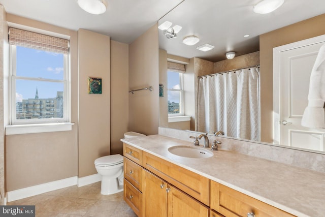 bathroom with tile patterned flooring, vanity, toilet, and a shower with curtain