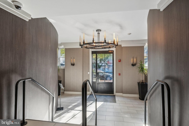 interior space featuring light tile patterned flooring and a chandelier