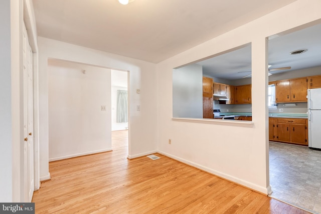 unfurnished living room featuring light hardwood / wood-style flooring