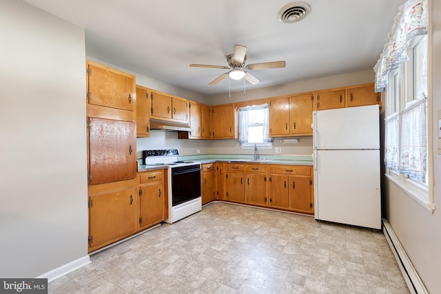 kitchen with ceiling fan, sink, white appliances, and a baseboard heating unit