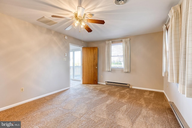 carpeted spare room with baseboard heating and ceiling fan