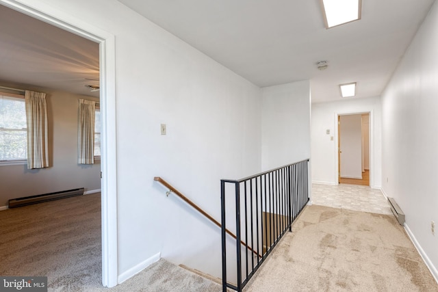 hall featuring light carpet and a baseboard radiator