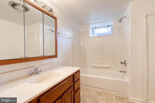 bathroom featuring vanity and shower / bath combination