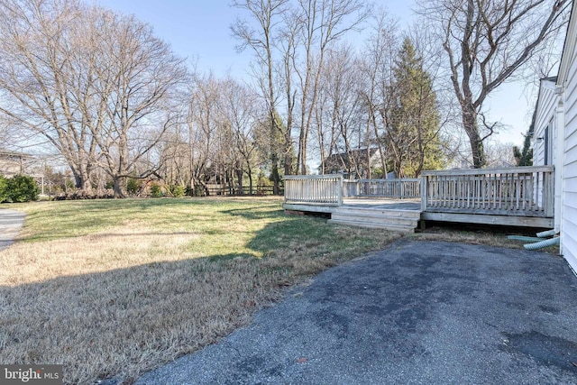 view of yard with a wooden deck