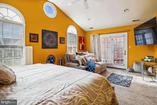 carpeted bedroom with access to outside, vaulted ceiling, and ceiling fan