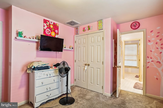 bedroom with light colored carpet