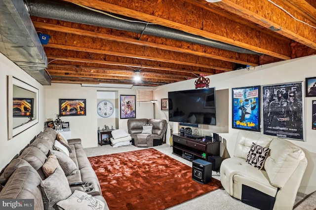 carpeted living room featuring beam ceiling