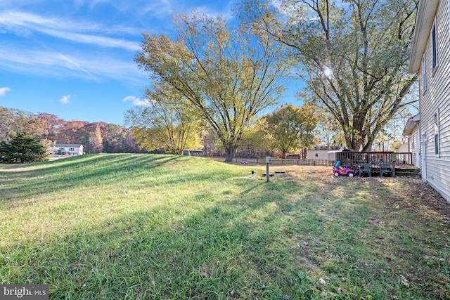 view of yard with a wooden deck