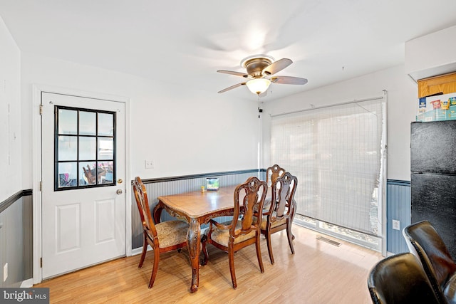 dining space featuring ceiling fan and light hardwood / wood-style floors