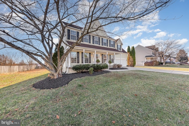 view of front of property featuring covered porch and a front lawn