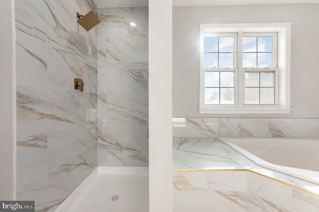 bathroom featuring separate shower and tub