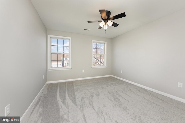 carpeted empty room with ceiling fan