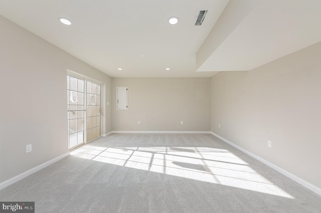 empty room featuring light colored carpet