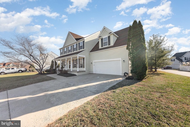 view of front of home with a porch, a garage, and a front lawn