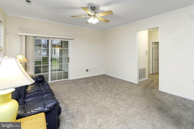 living room featuring ceiling fan, light colored carpet, and crown molding