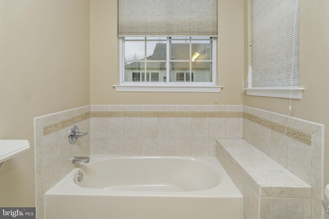 bathroom with a tub to relax in