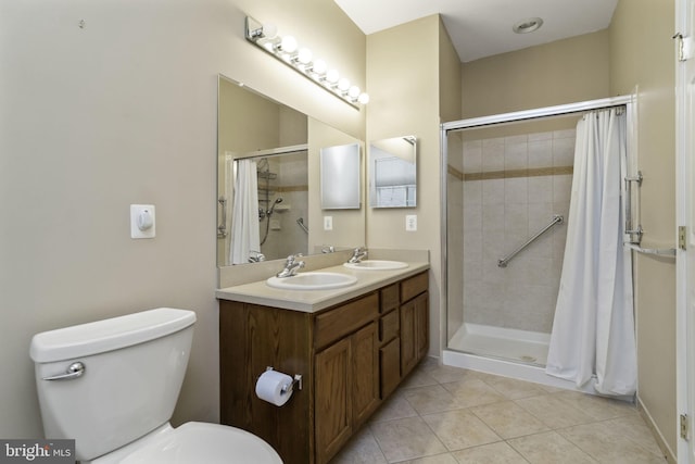 bathroom featuring tile patterned floors, toilet, vanity, and a shower with shower curtain