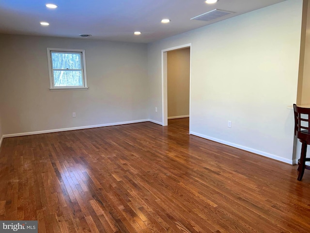 empty room featuring dark wood-type flooring