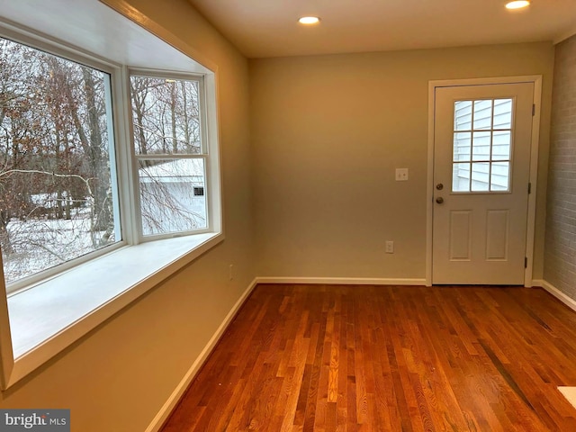 doorway featuring dark hardwood / wood-style flooring