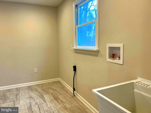 laundry area featuring washer hookup and sink