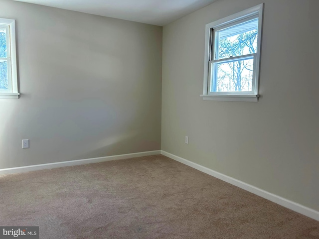 unfurnished room with carpet flooring