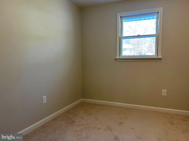 empty room featuring light colored carpet