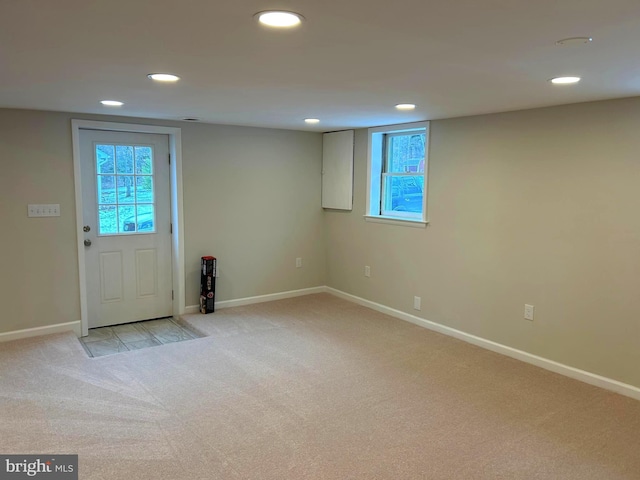 entrance foyer featuring light colored carpet