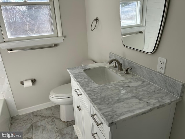 bathroom featuring vanity and toilet