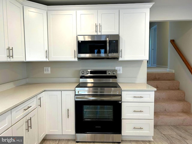 kitchen featuring white cabinets and stainless steel appliances