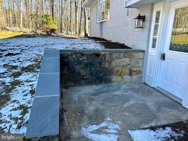 view of snow covered patio